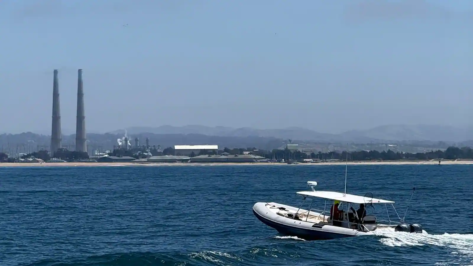 Ocean Spirit RHIB underway on Monterey Bay with Moss Landing smokestacks in background