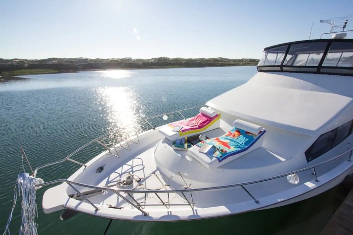 a boat is docked next to a body of water