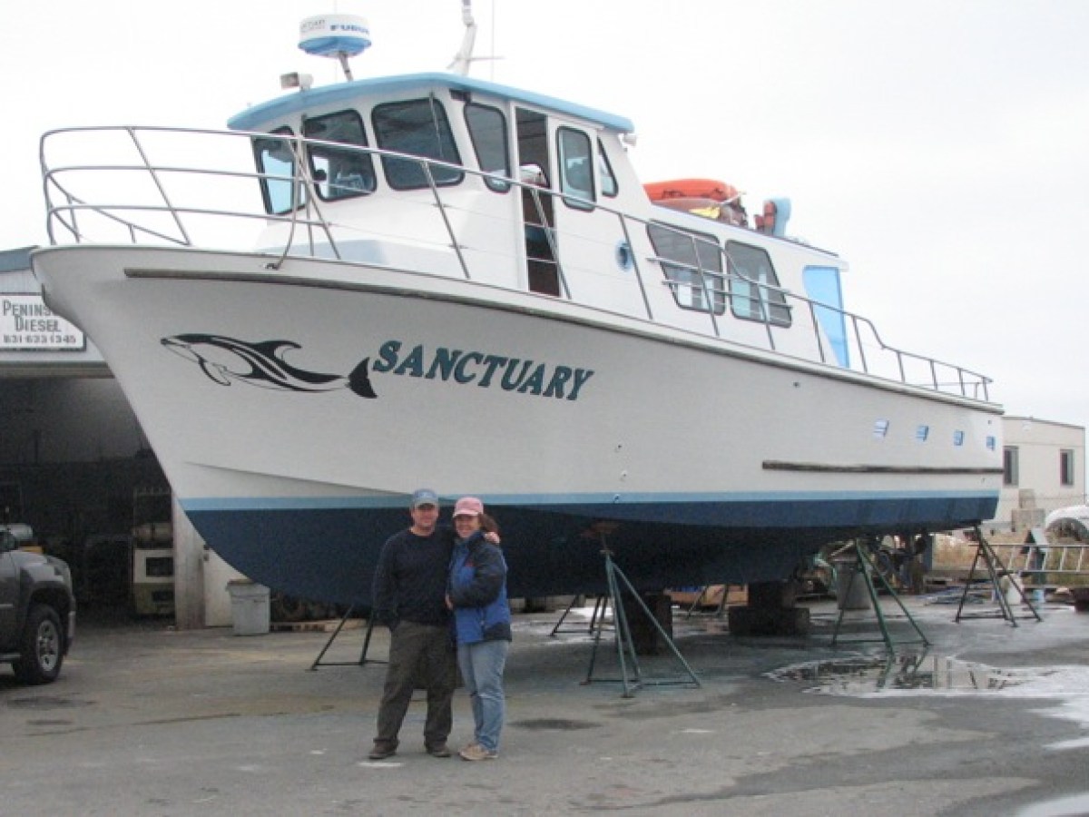 a person standing in front of a boat